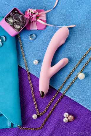 Нежно-розовый вибратор с отростком для стимуляции клитора MERYL