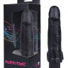 Реалистичный вибромассажер черного цвета с мошонкой